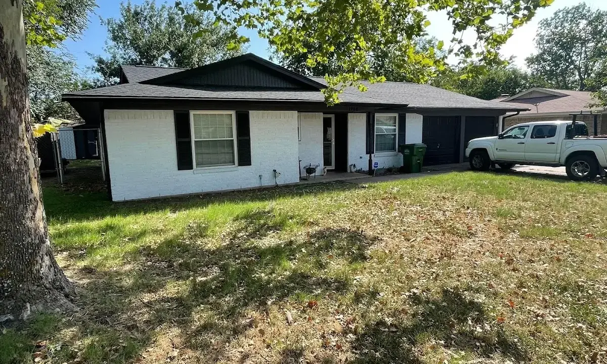 Professional roofing crew working on a residential roof in Forest Glen